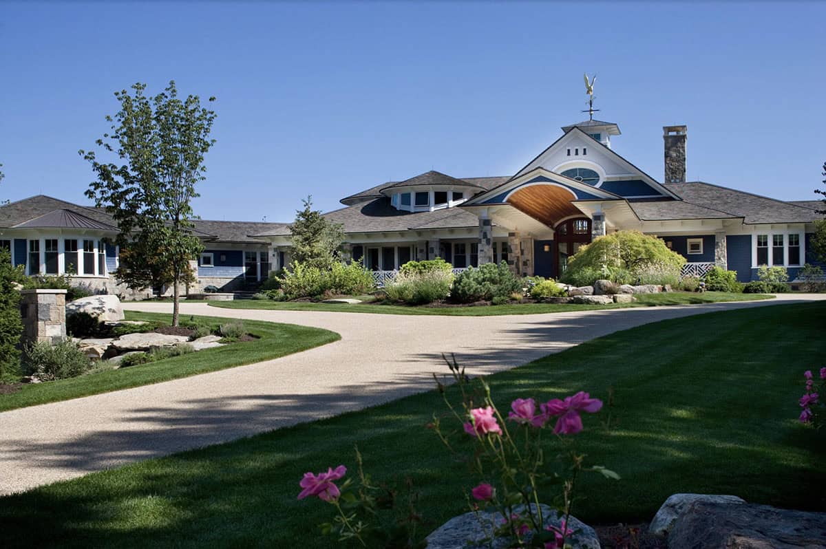 Blue Shingle Country Estate Exterior With Curved Wood Porte-Cochere and Weather Vane