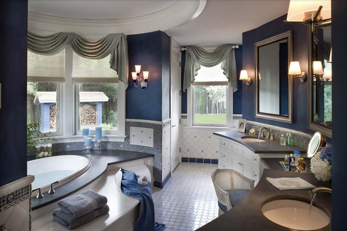 Luxurious Navy Blue Primary Bathroom With Round Soaking Tub and Swag Valances