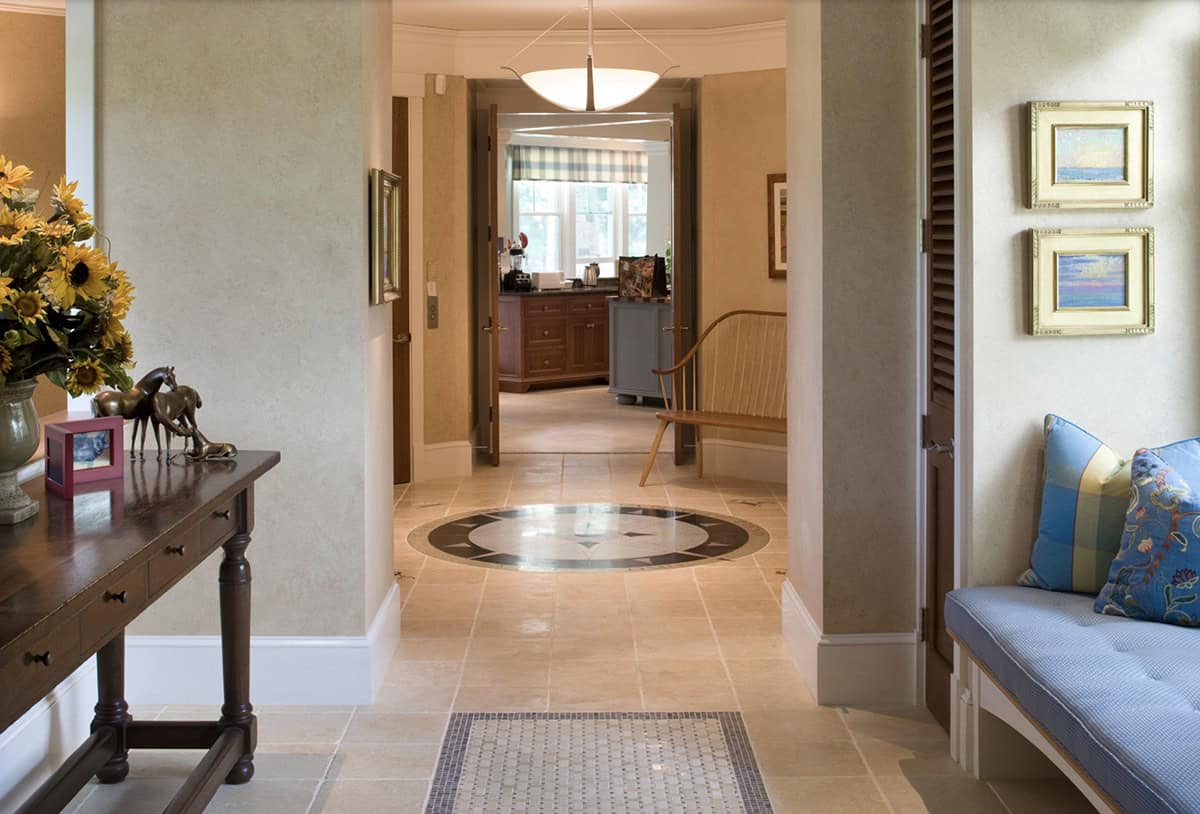 Foyer Hallway With Marble Compass Rose Floor Medallion and Console Table