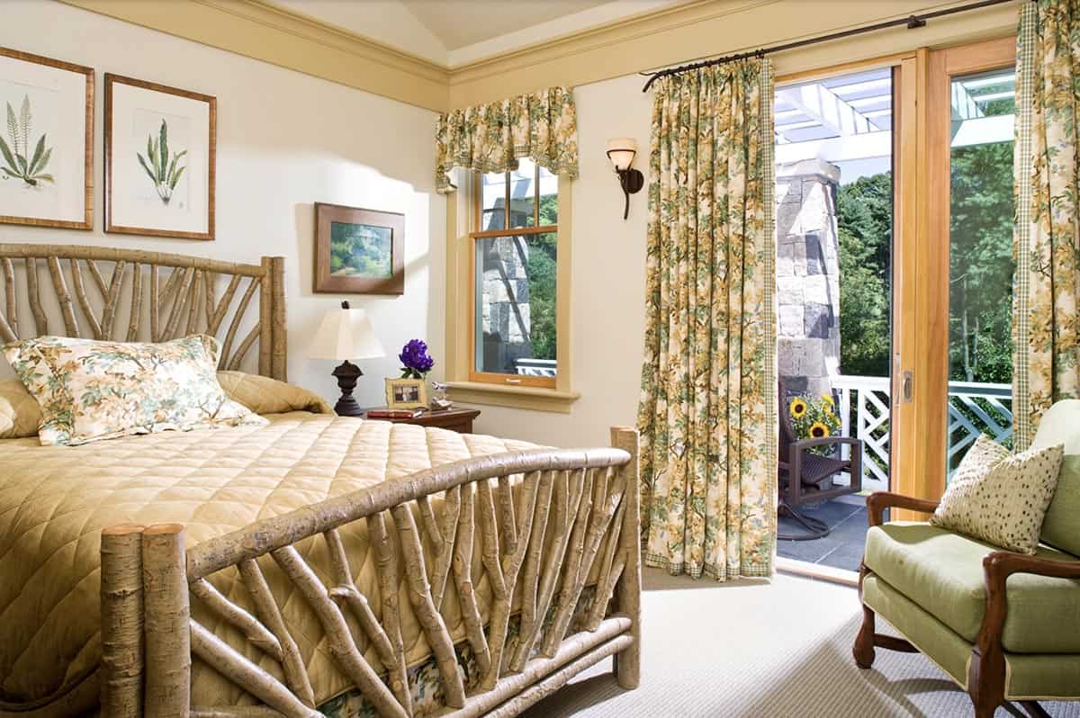transitional style guest house bedroom with sliding glass doors leading to private porch