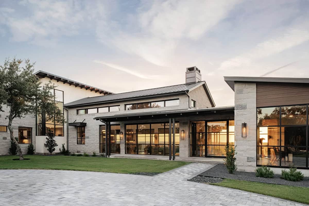 Exterior view of contemporary Hill Country ranch home at dusk, Round Mountain Texas