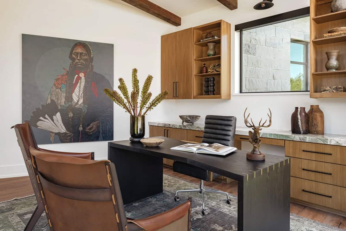 Home office with wood built-ins, green marble countertop and large-scale Native American artwork