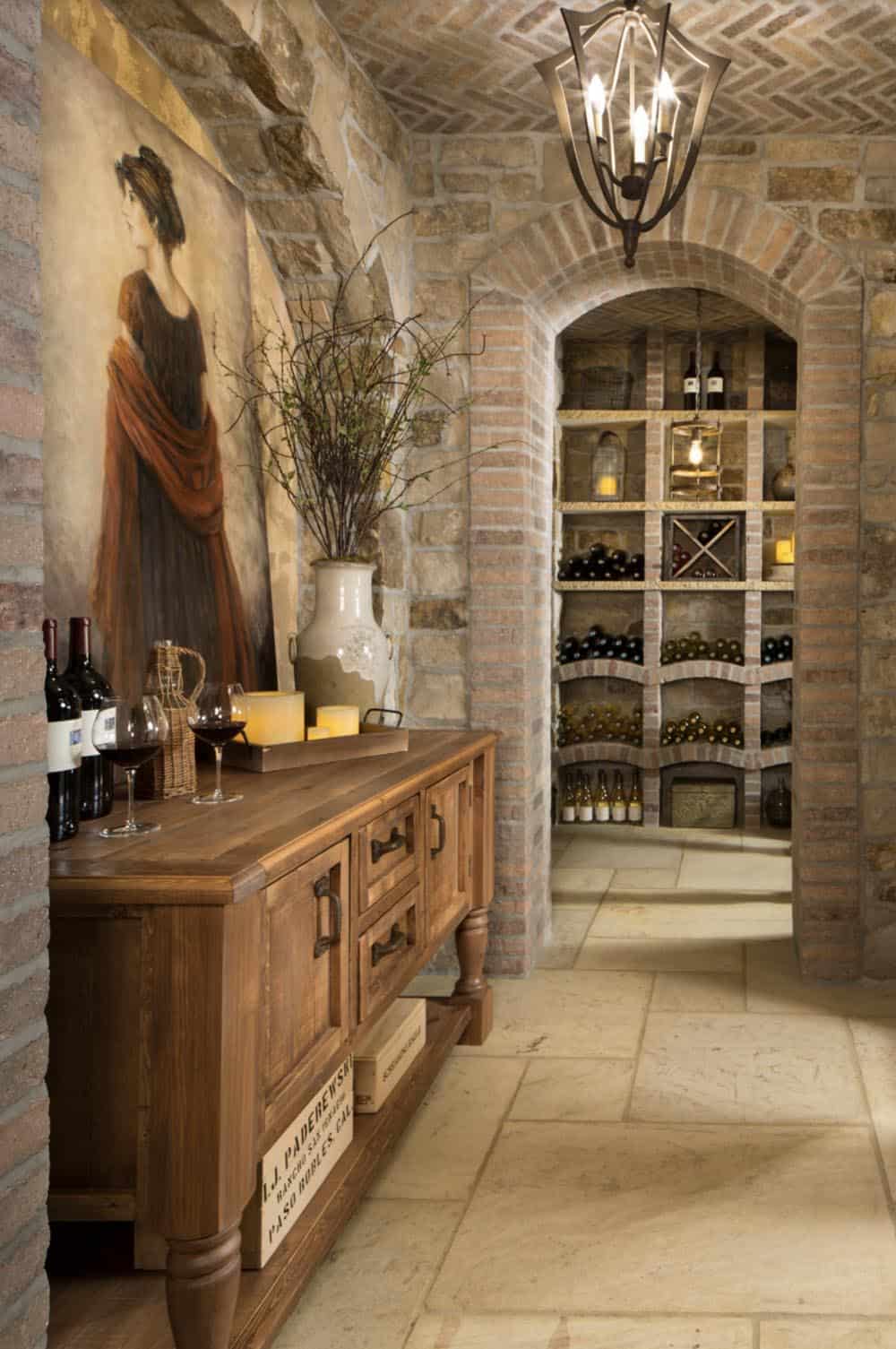 Wine cellar entrance with brick arched ceiling, mural, and bottle storage beyond