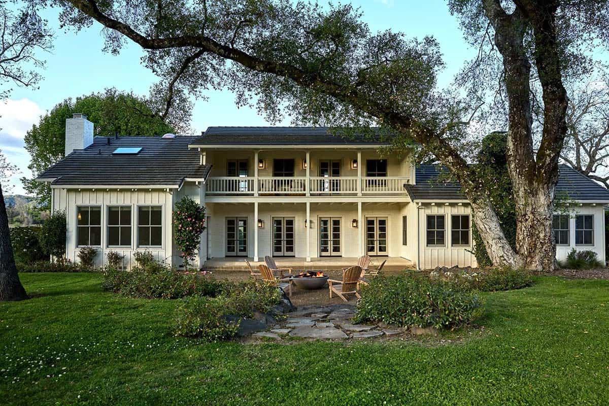 Wine country farmhouse exterior with fire pit and balcony in Healdsburg, California