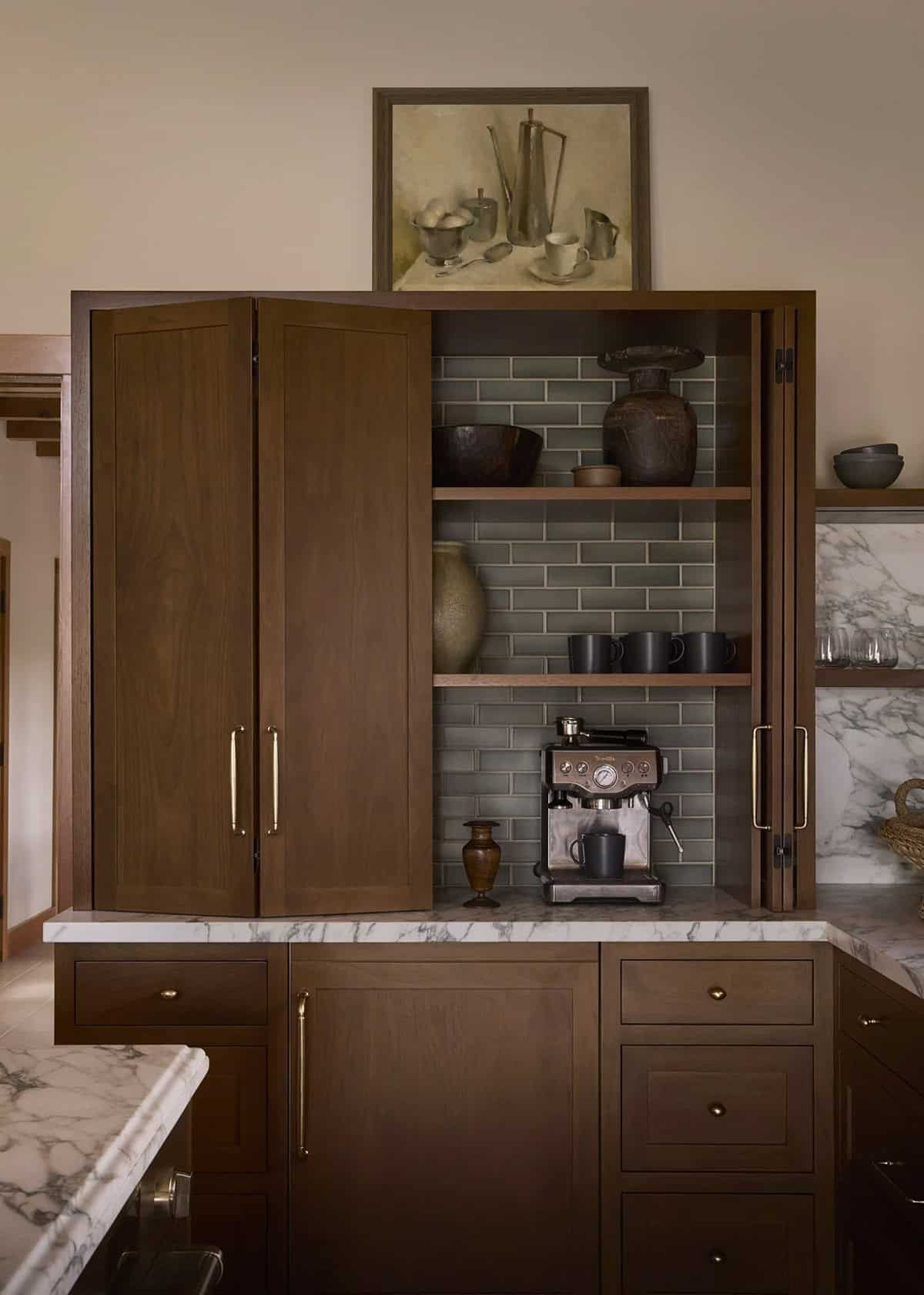 Hidden coffee station with sage subway tile inside walnut cabinetry