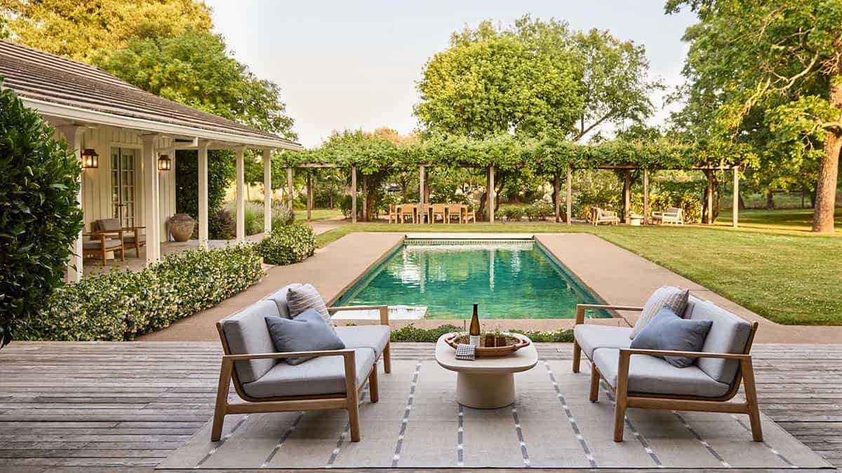Pool and pergola with teak outdoor seating at Dry Creek Retreat Healdsburg