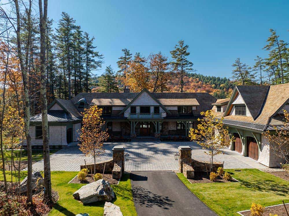 Aerial view of East Cove Estate entrance with shingle-style architecture and fall foliage
