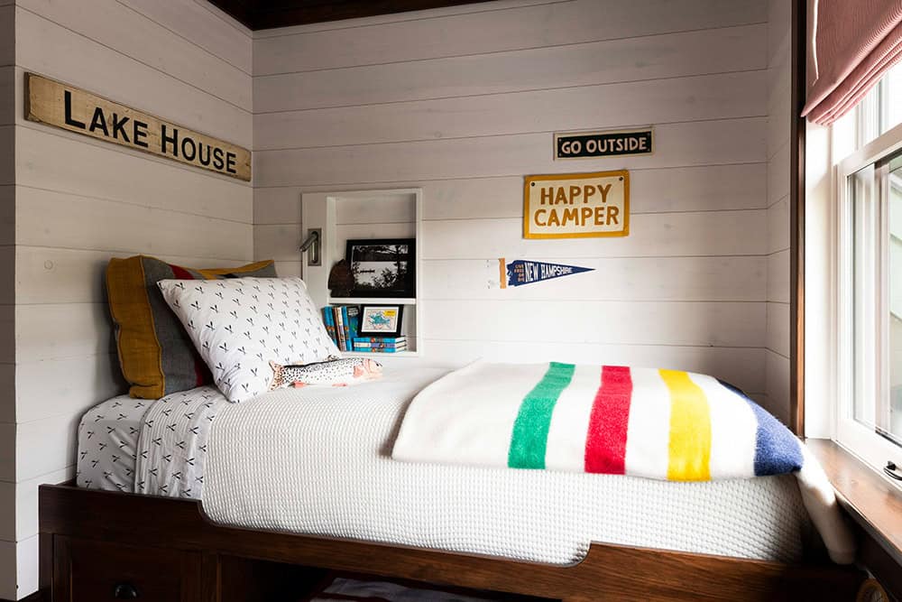 Kids' bunk nook with shiplap walls and Lake House and Happy Camper camp signs