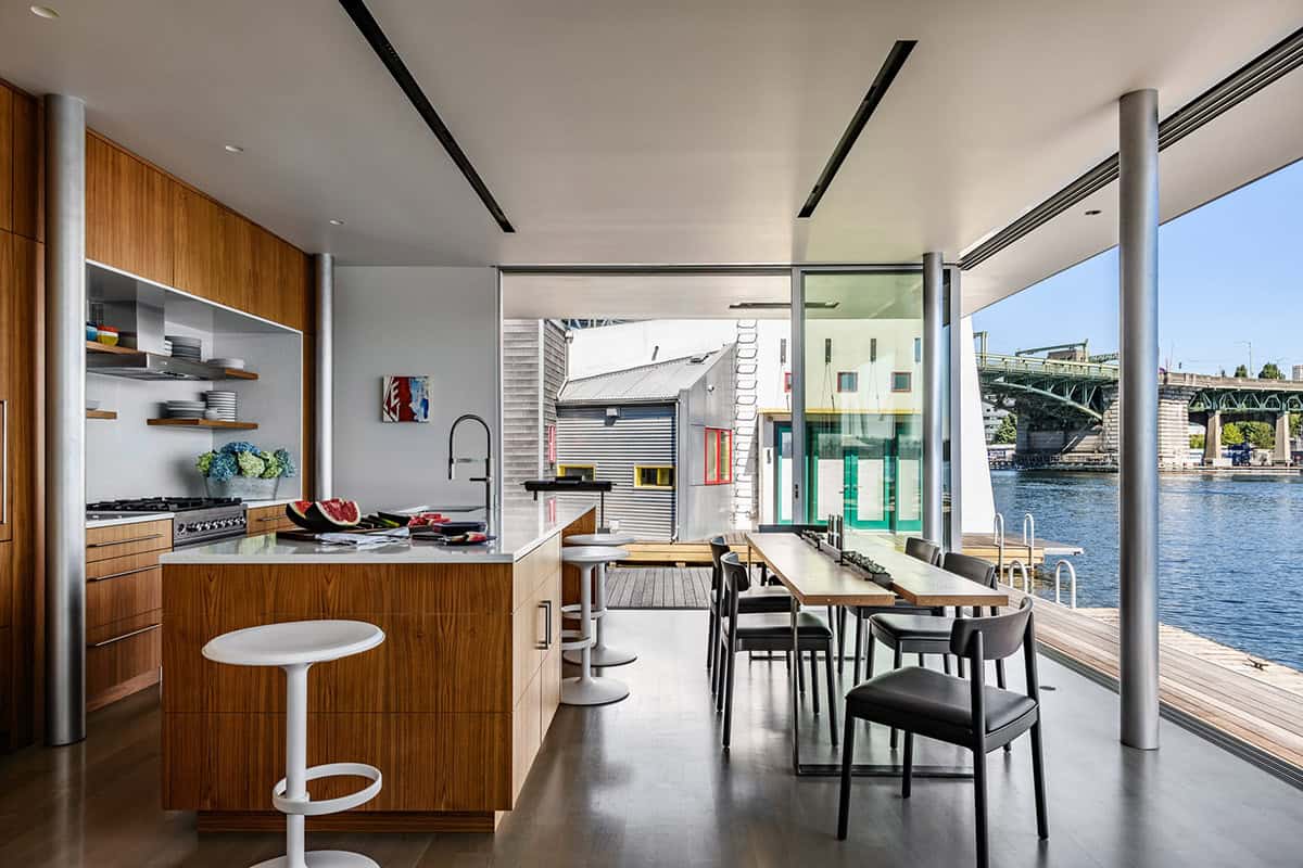 Open-plan kitchen and dining with water views and bridge beyond
