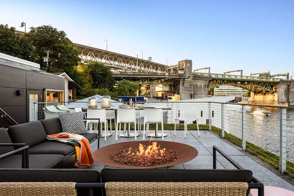 Rooftop terrace with fire pit and outdoor dining overlooking Portage Bay and Seattle bridge