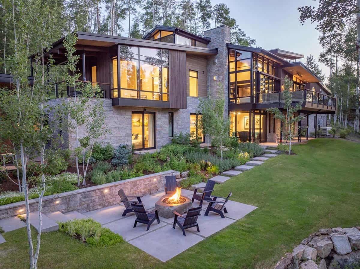 2:03 PMClaude responded: Dusk rear exterior with stone fire bowl, Adirondack chairs, terraced garden, and glowing multi-level stone and glass facadeDusk rear exterior with stone fire bowl, Adirondack chairs, terraced garden, and glowing multi-level stone and glass facade