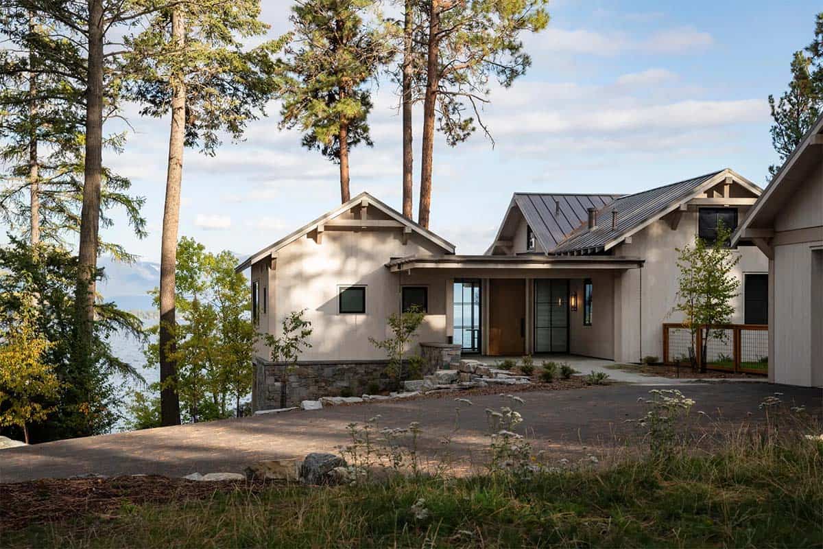 Contemporary lake house exterior nestled among pines on Flathead Lake