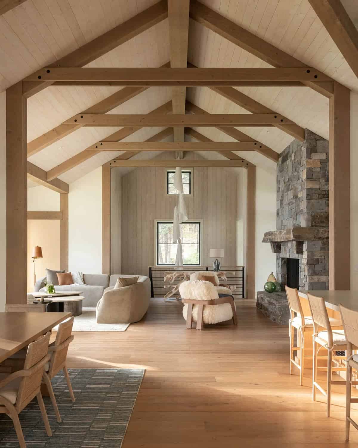 Vaulted great room with wood beams and stone fireplace