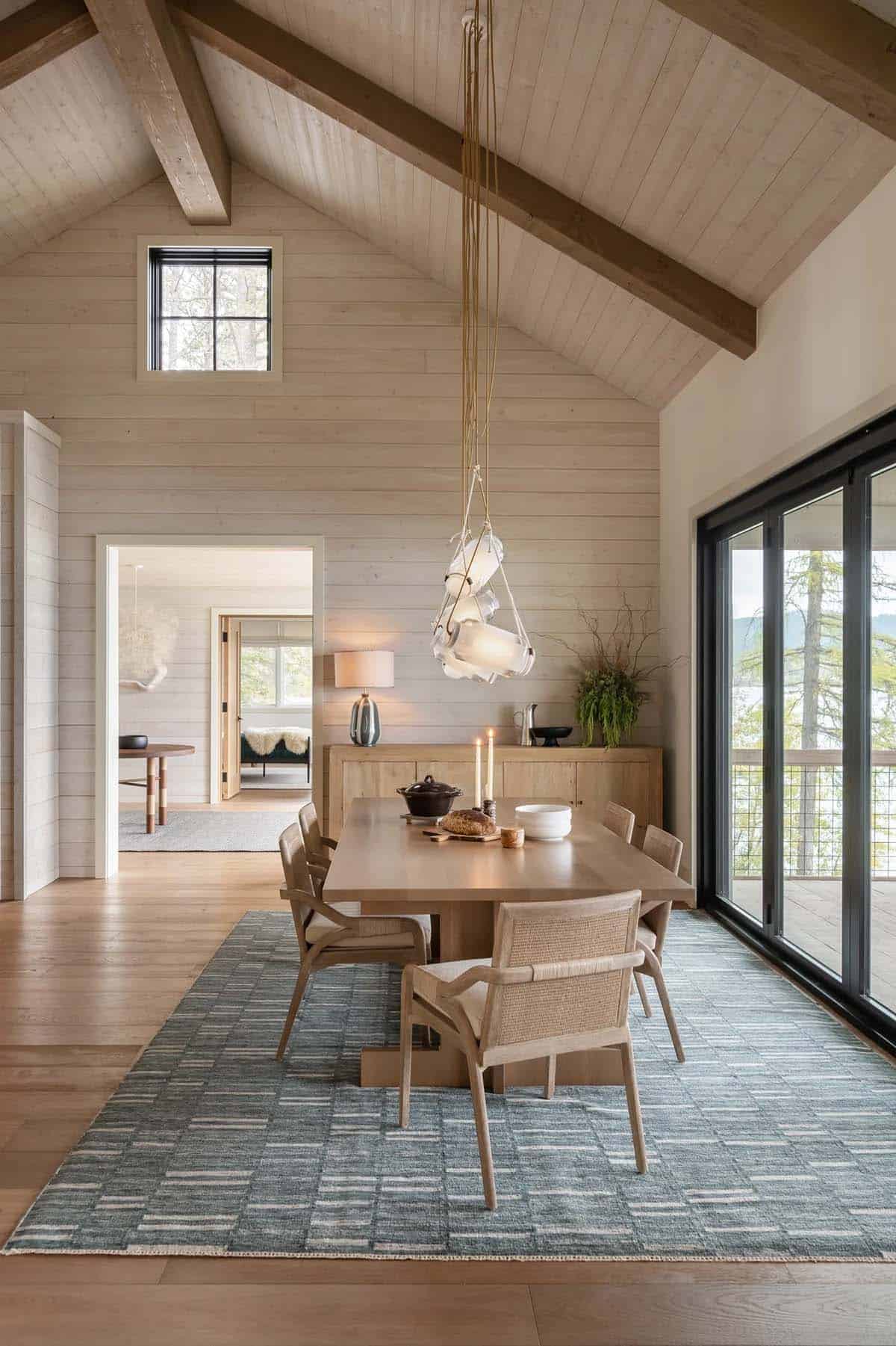 Dining area with shiplap walls and glass pendant lighting