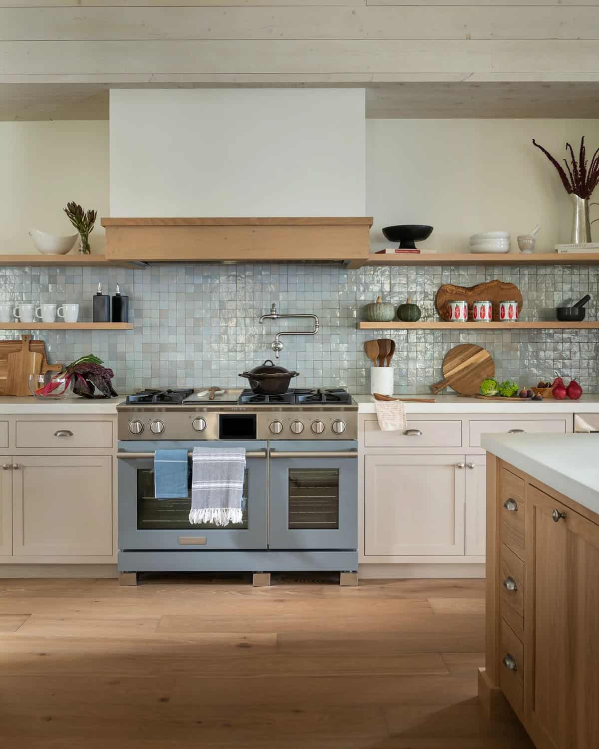 Kitchen with blue Zellige tile backsplash and range