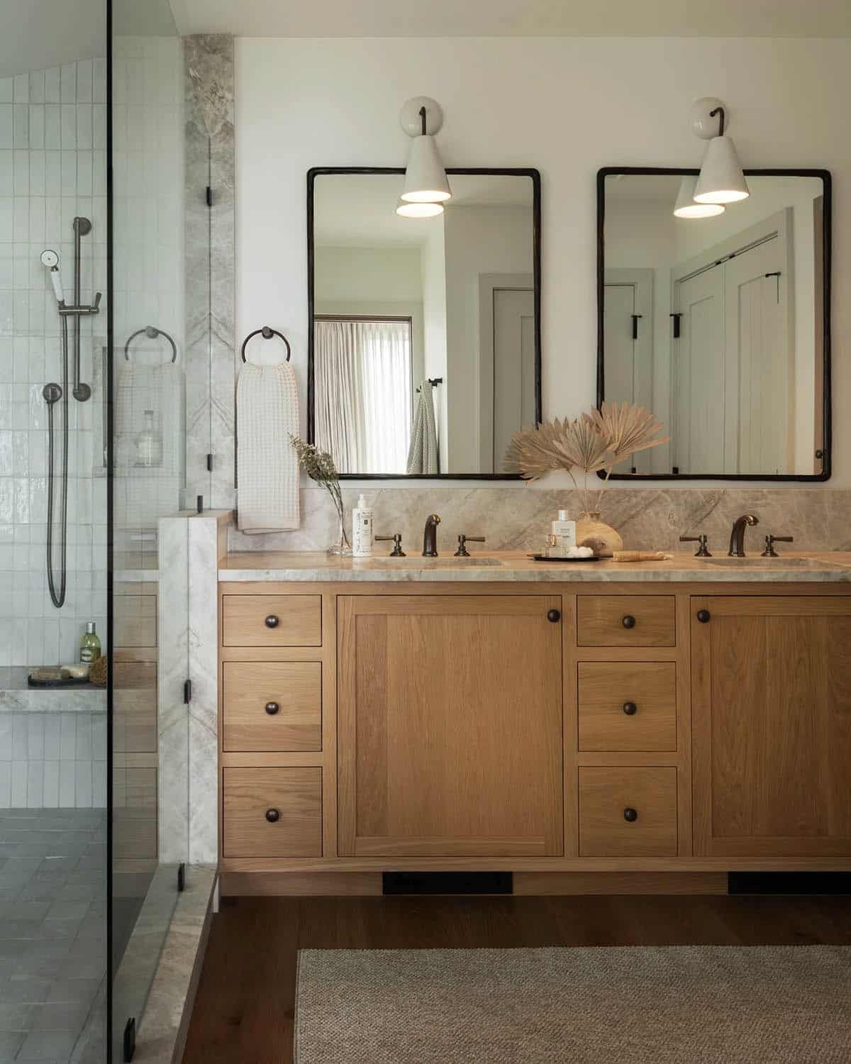 Primary bathroom double vanity with marble countertop