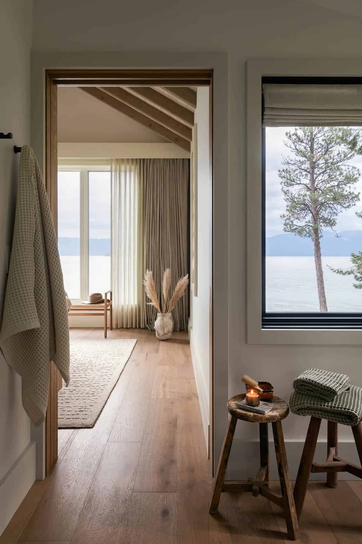 Bedroom hallway with stool seating and lake-view window
