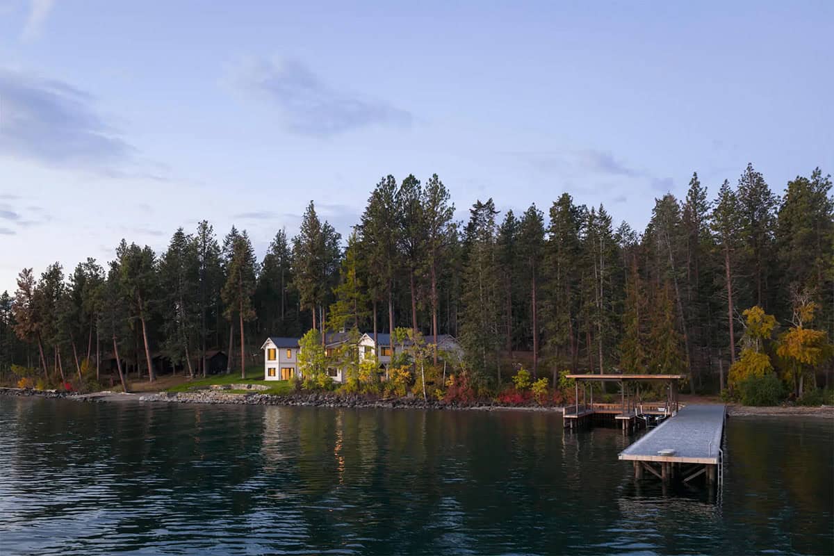 Aerial view of the lake house nestled among pine trees