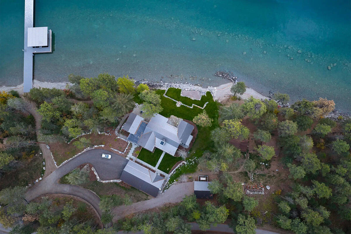 Aerial view of the property along the rocky shoreline