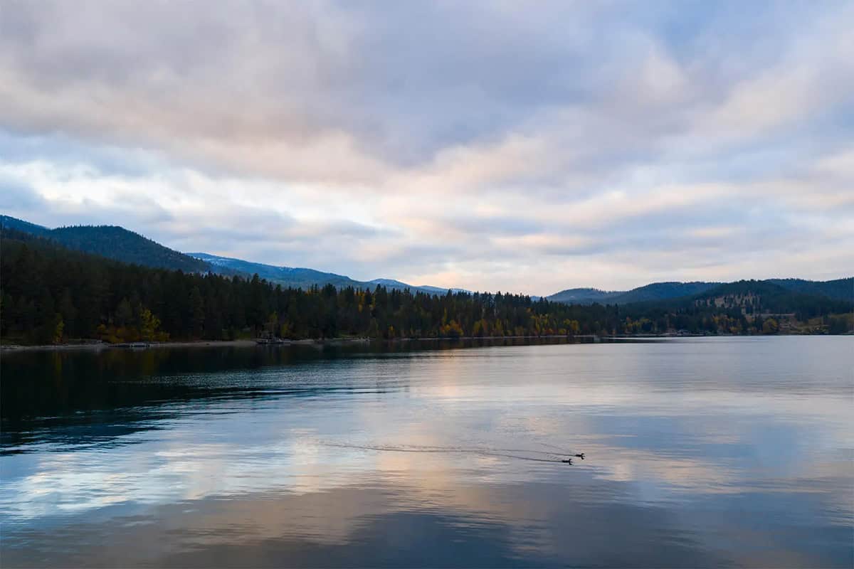 Flathead Lake view with mountains and a cloudy sky