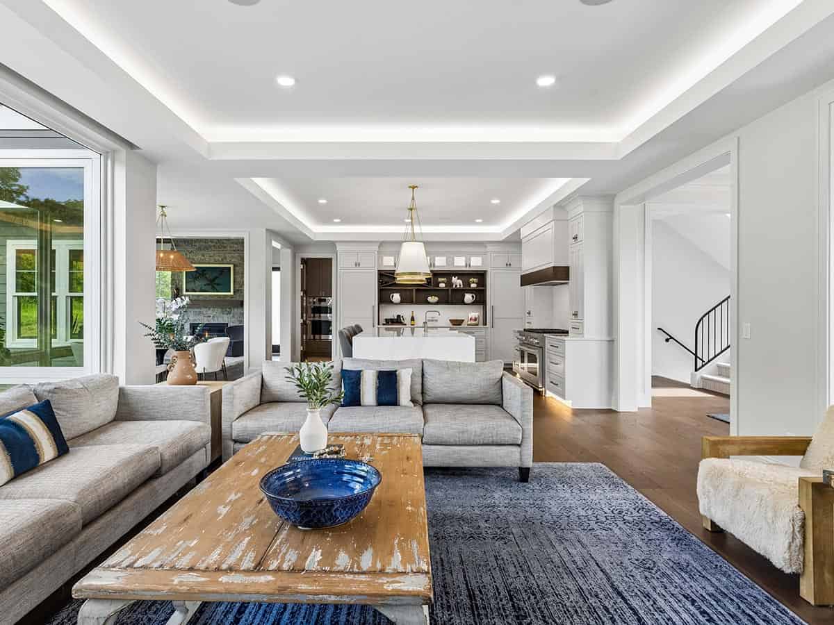 Great room with sectional sofas overlooking open kitchen