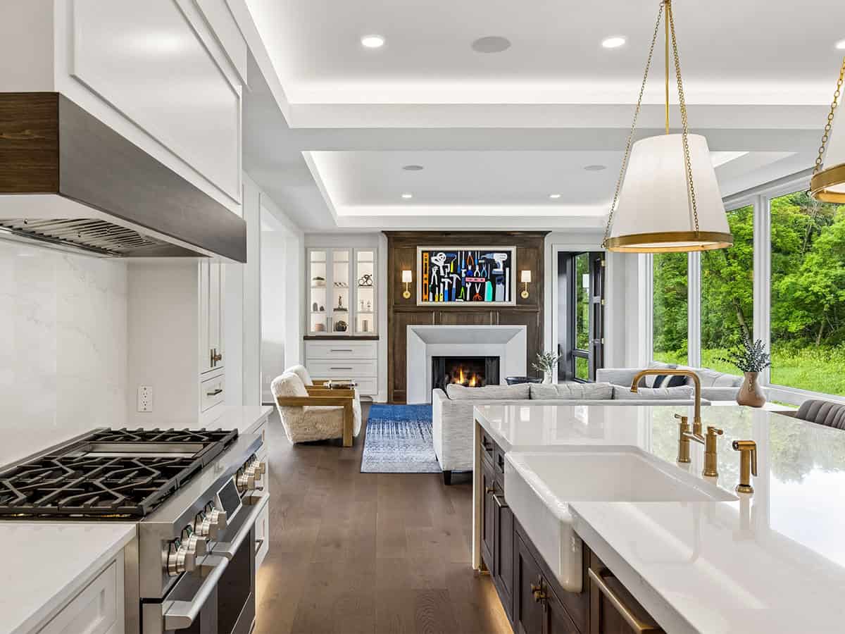 Kitchen island view toward living room fireplace and art