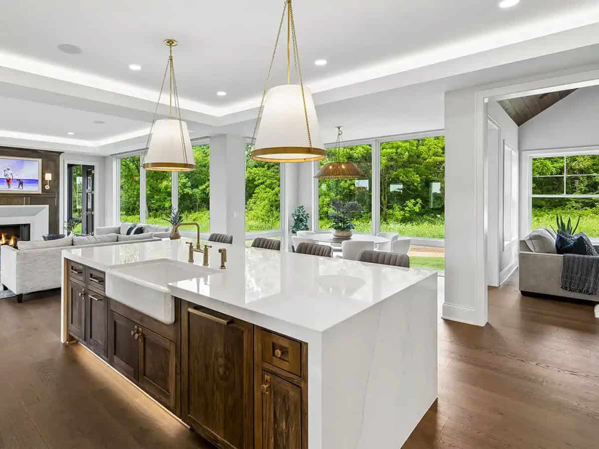 Kitchen island with farmhouse sink and brass gooseneck faucet