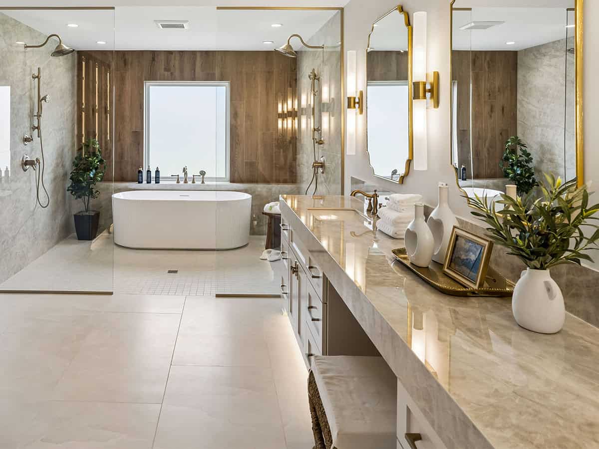 Soaking tub against wood-paneled wall with glass shower enclosure