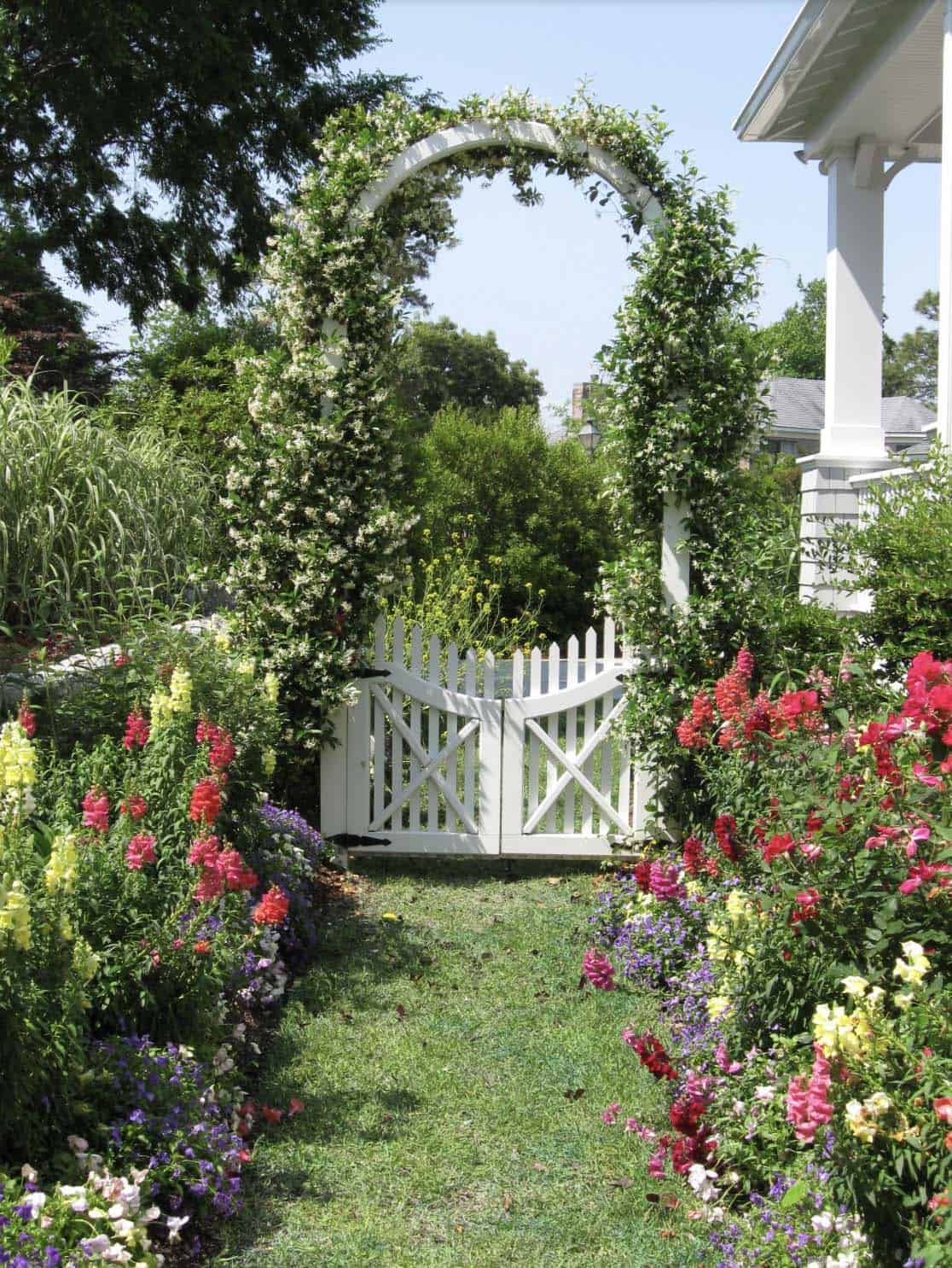 Claude responded: White garden arch covered in climbing roses over a picket gate, flanked by snapdragons, lobelia, and mixed cottage garden bordersWhite garden arch covered in climbing roses over a picket gate, flanked by snapdragons, lobelia, and mixed cottage garden borders