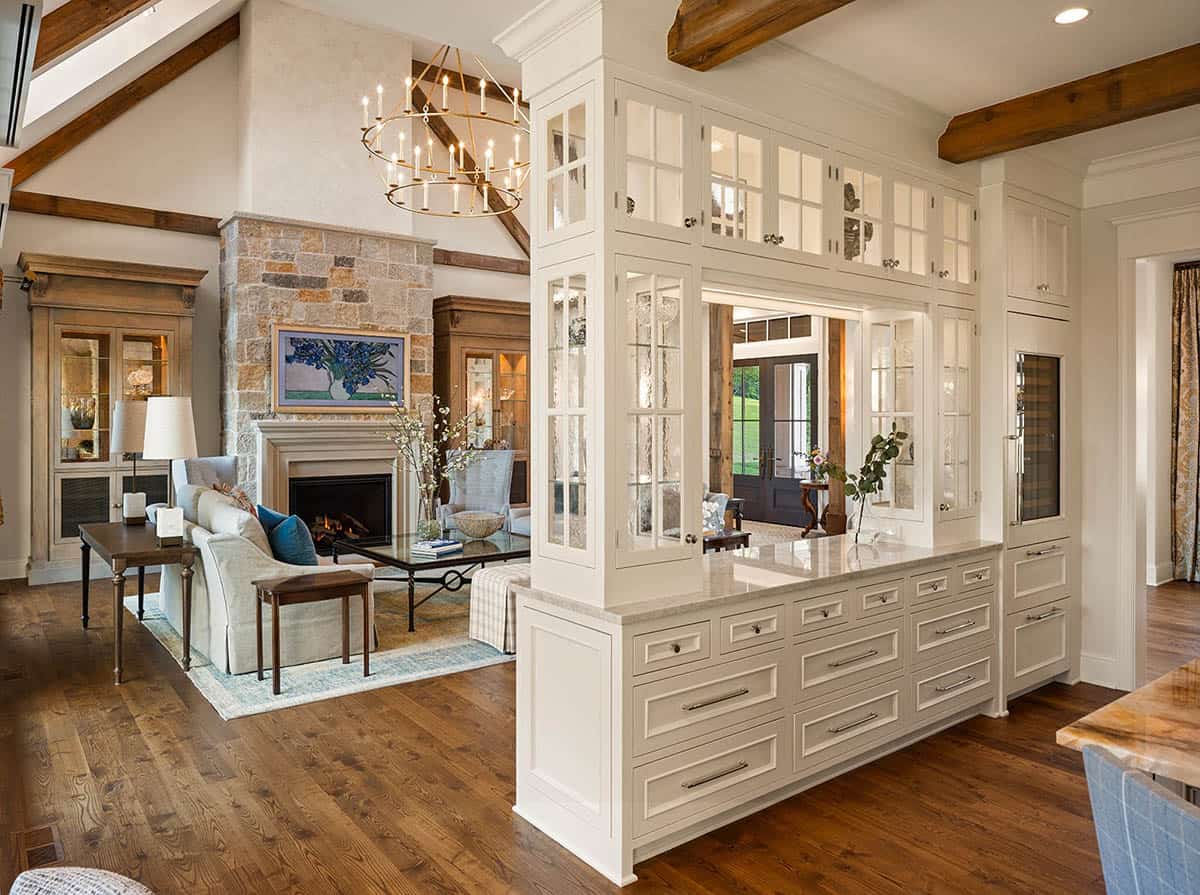 Open-concept kitchen and living room with glass cabinet pass-through