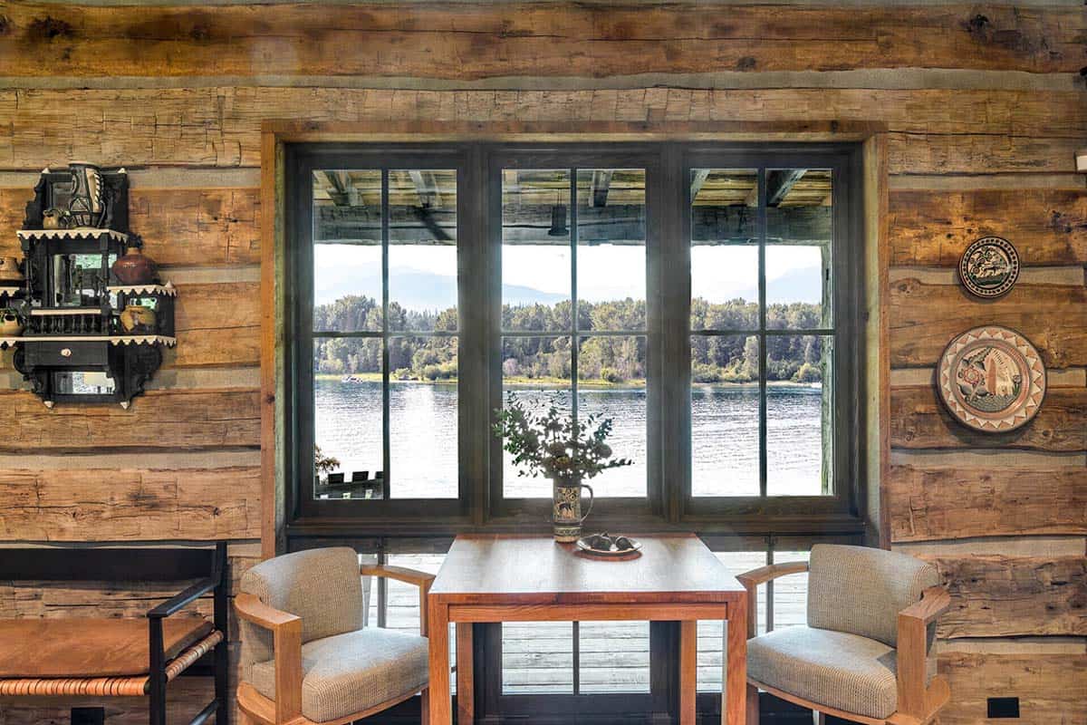 Small breakfast table with lake view through cabin window