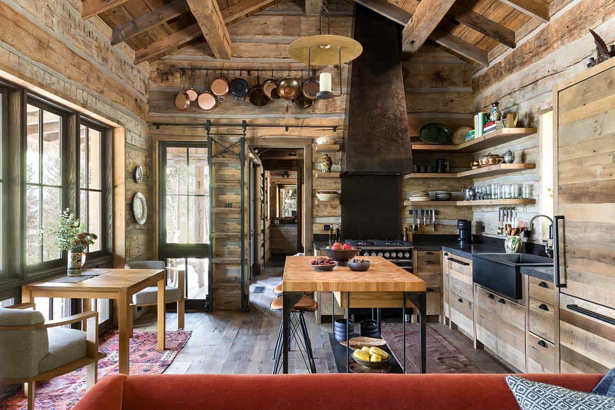 Log cabin kitchen with copper pots and open shelving
