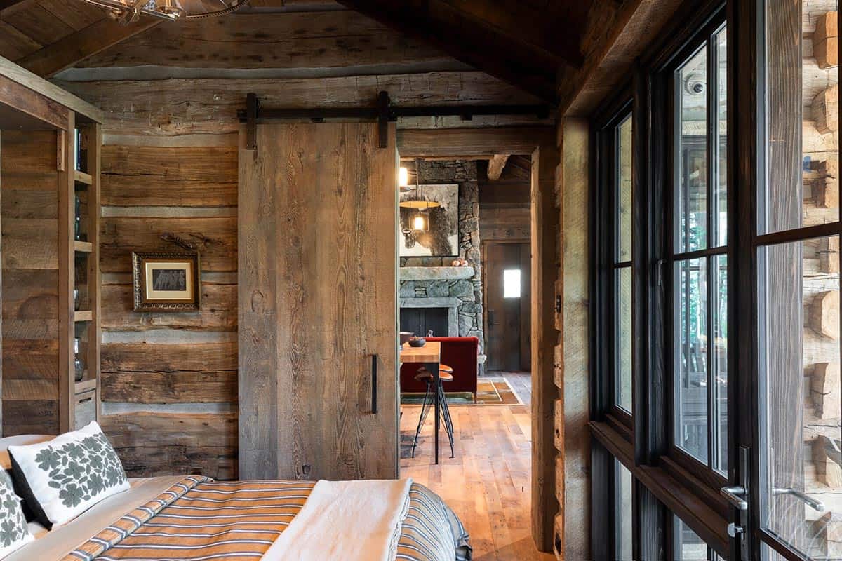 Bedroom with sliding barn door opening to living area