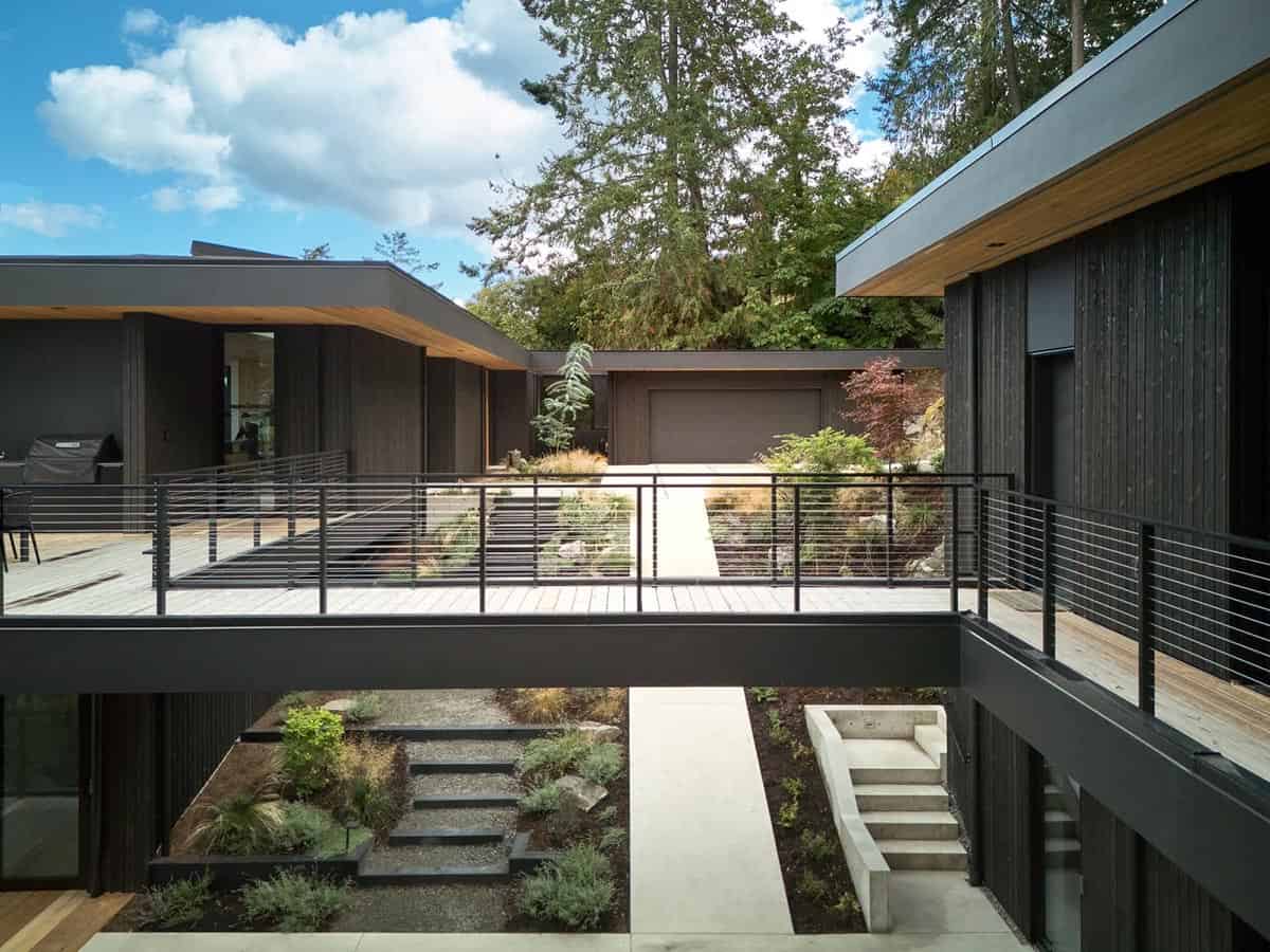 View across the bridge connecting Layer House to the accessory studio and woodshop