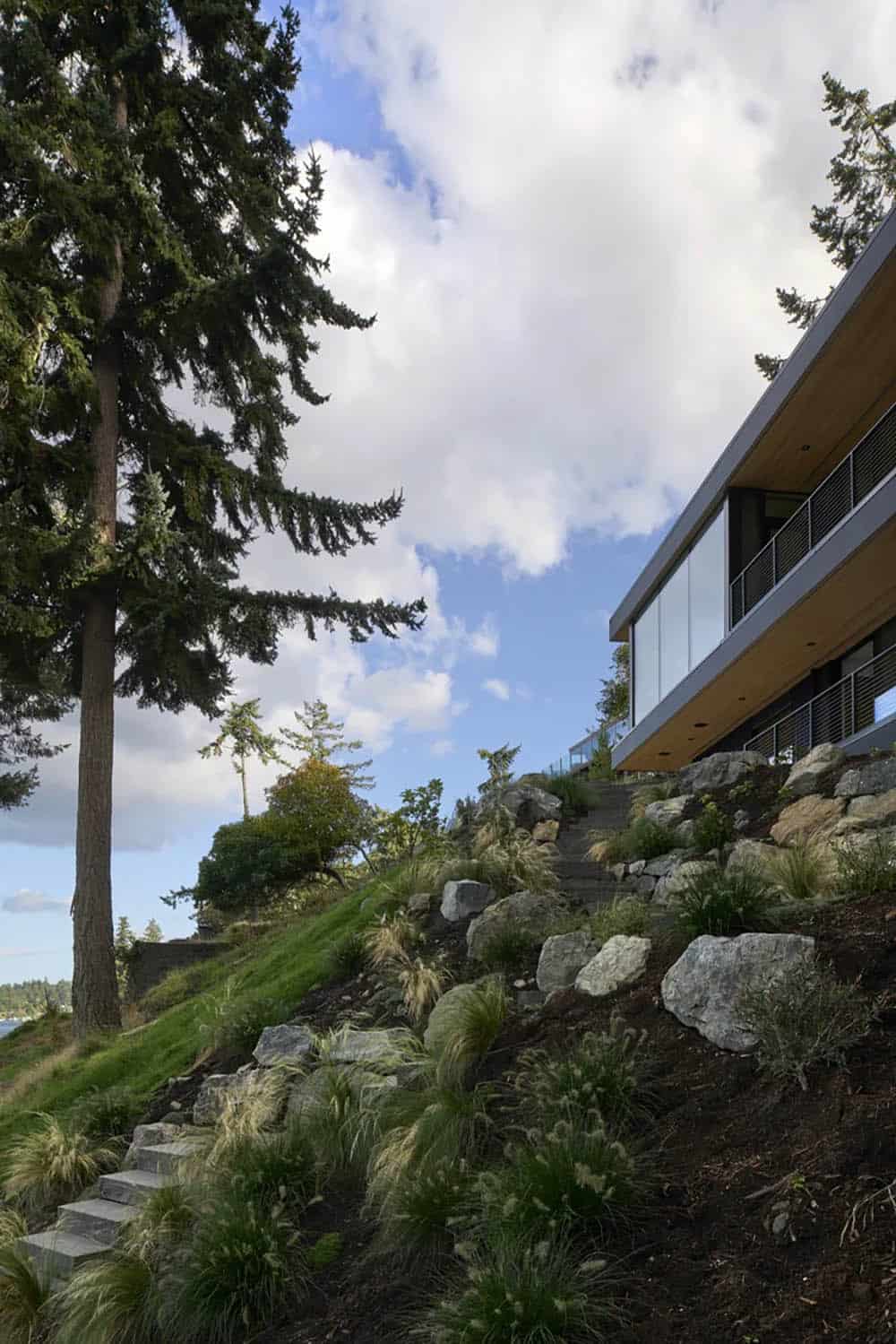 Stone steps cut into the hillside leading up to Layer House above Saanich Inlet