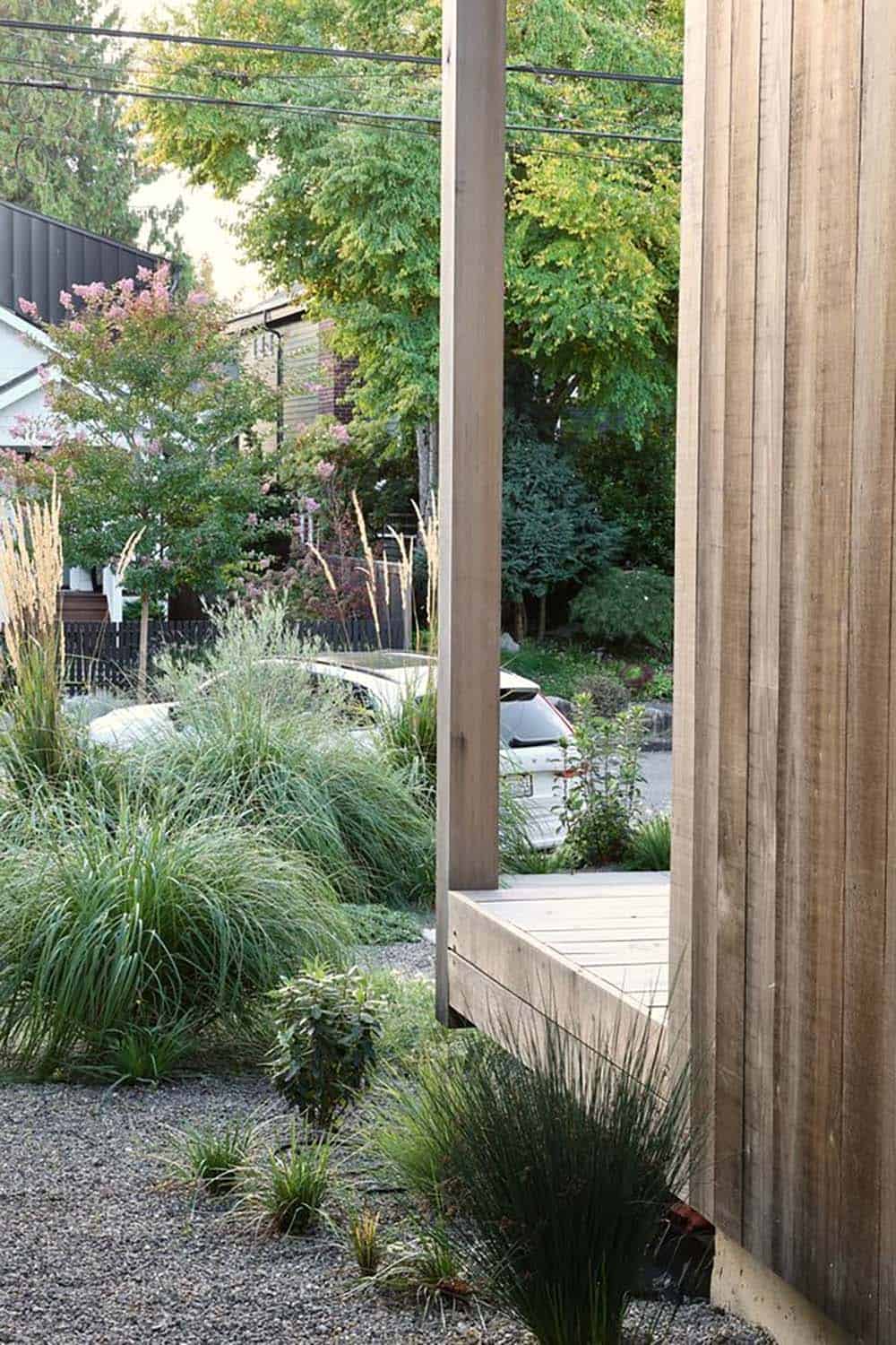 View from the covered front porch through native grasses toward the Madison Park street