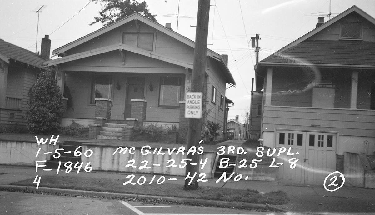 Historic black and white street view of the original bungalow