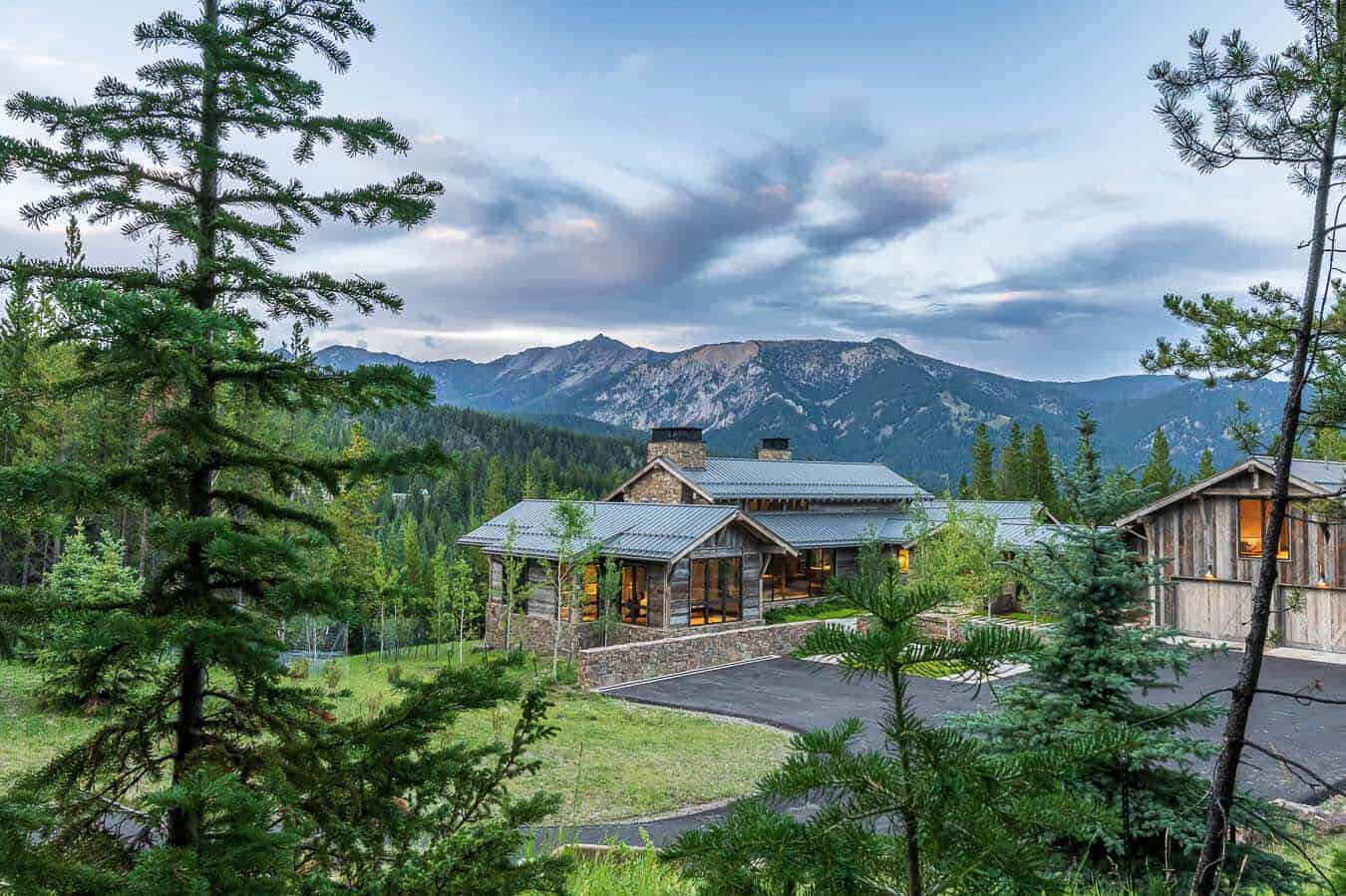 Modern alpine home nestled in Montana forest with Madison Range mountain views
