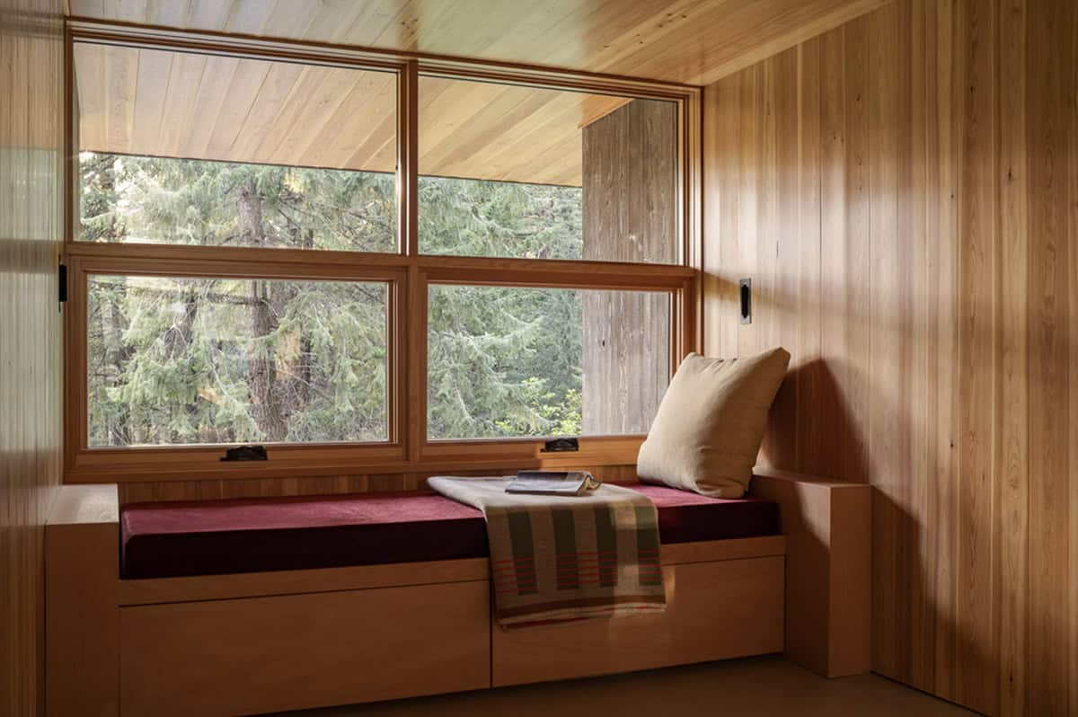 Douglas fir-lined nap room with built-in daybed and forest views