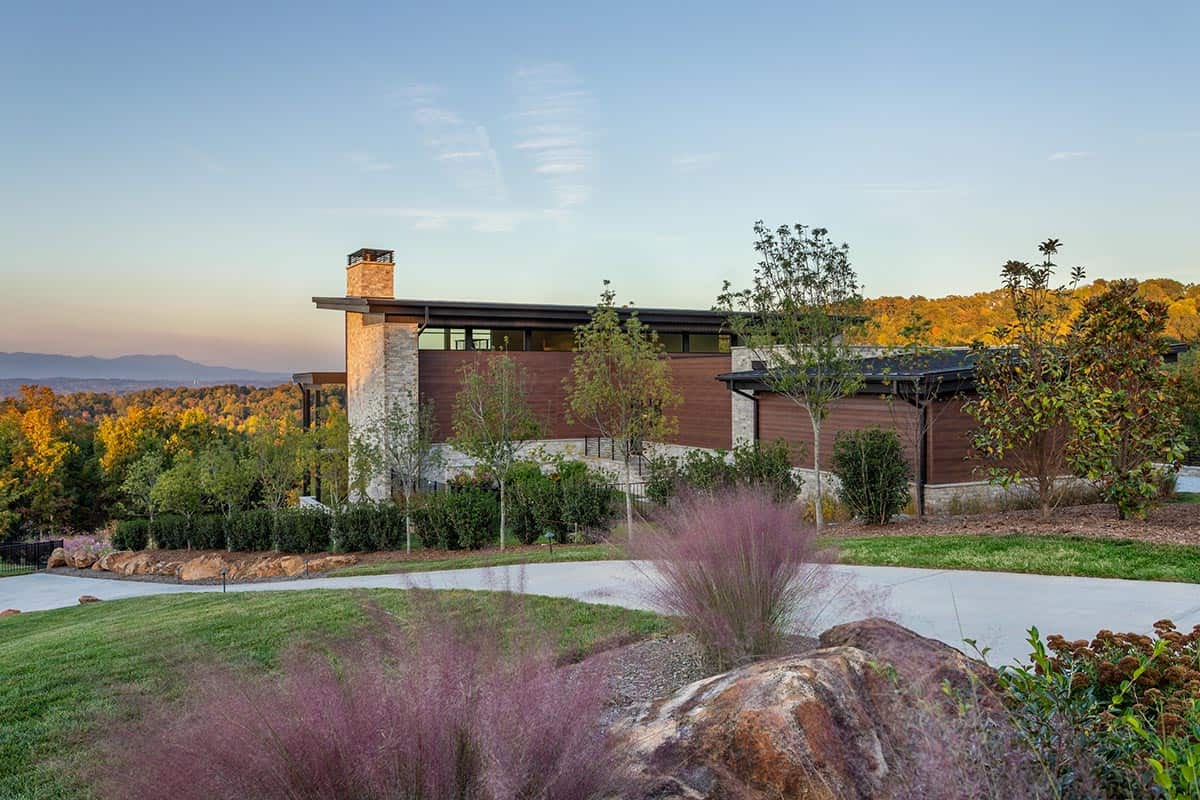 Mountain modern home at dusk with pink muhly grass and distant mountain views