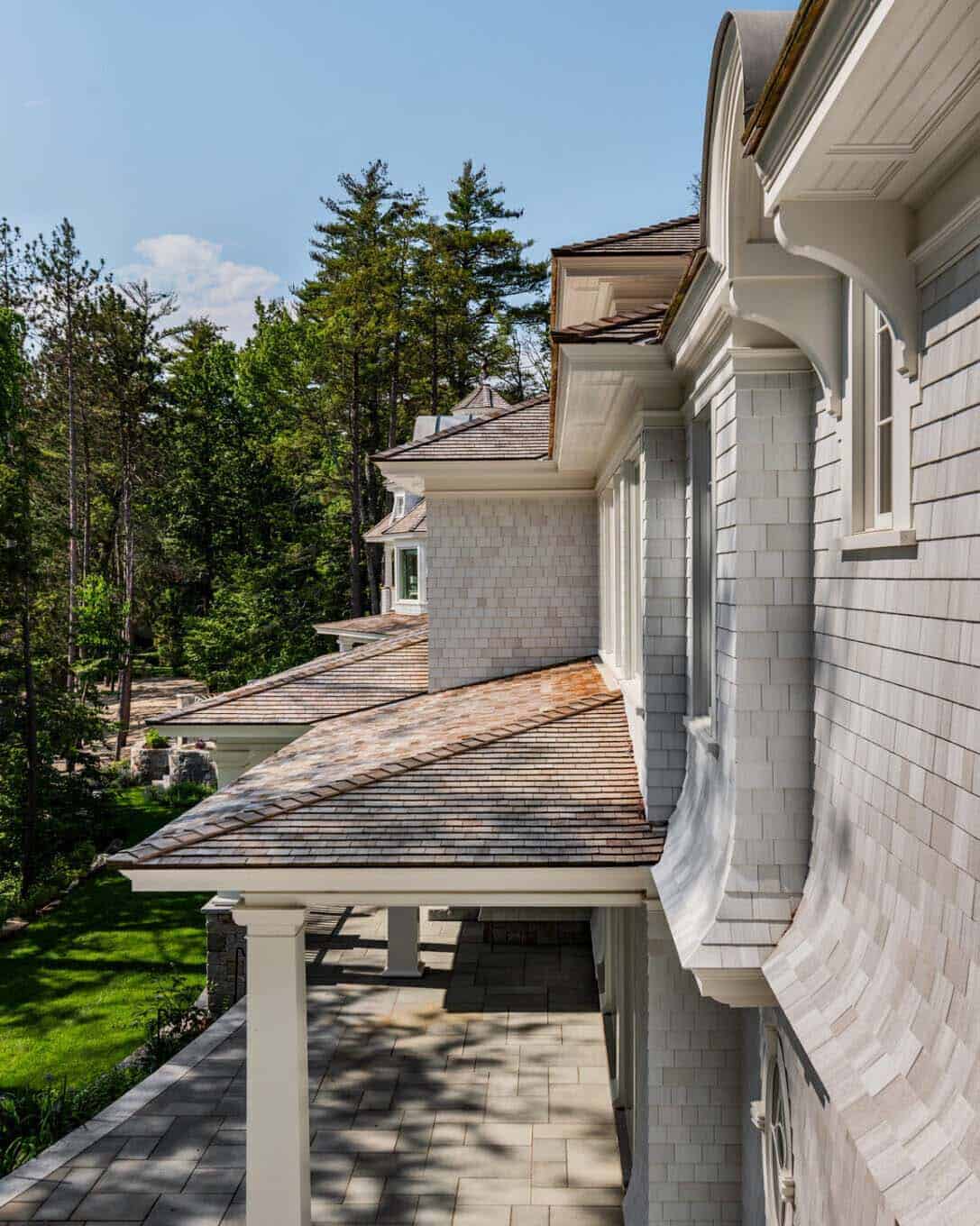 Close-up of cedar shake roofline and shingle siding along the home's exterior