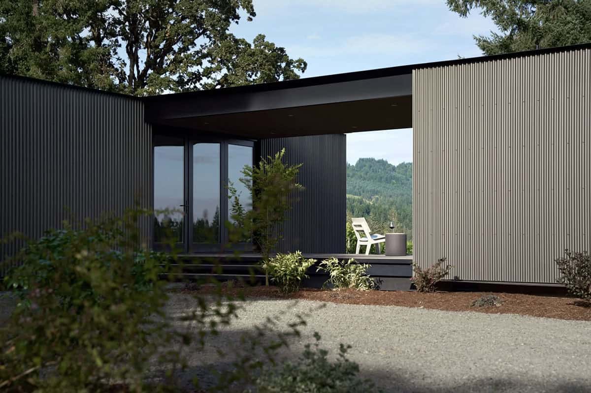 Breezeway corner showing dark and light corrugated metal siding