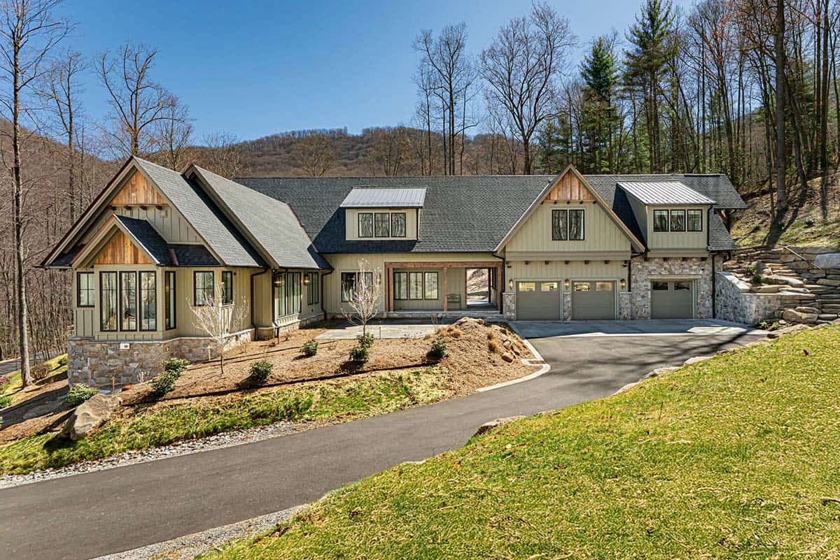 Mountain retreat exterior with curved driveway and stone accents