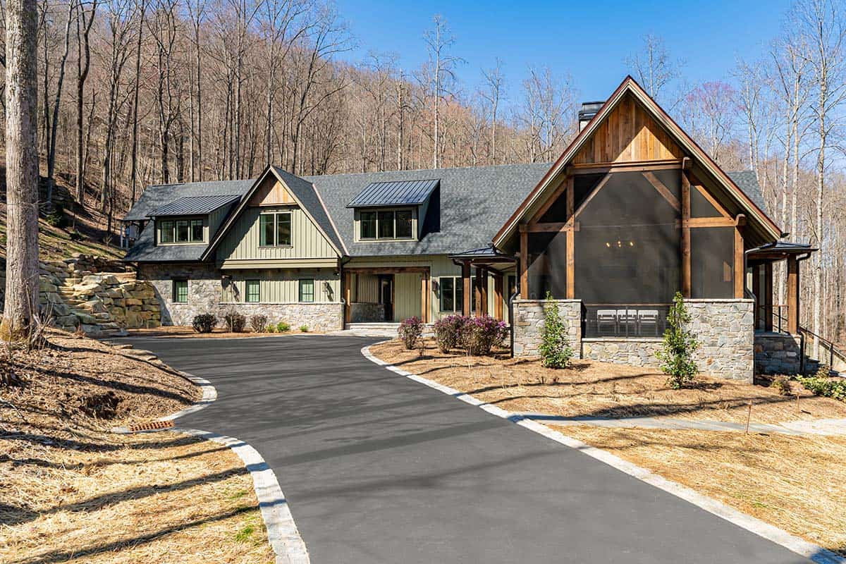 Home exterior with screened porch and stone chimney