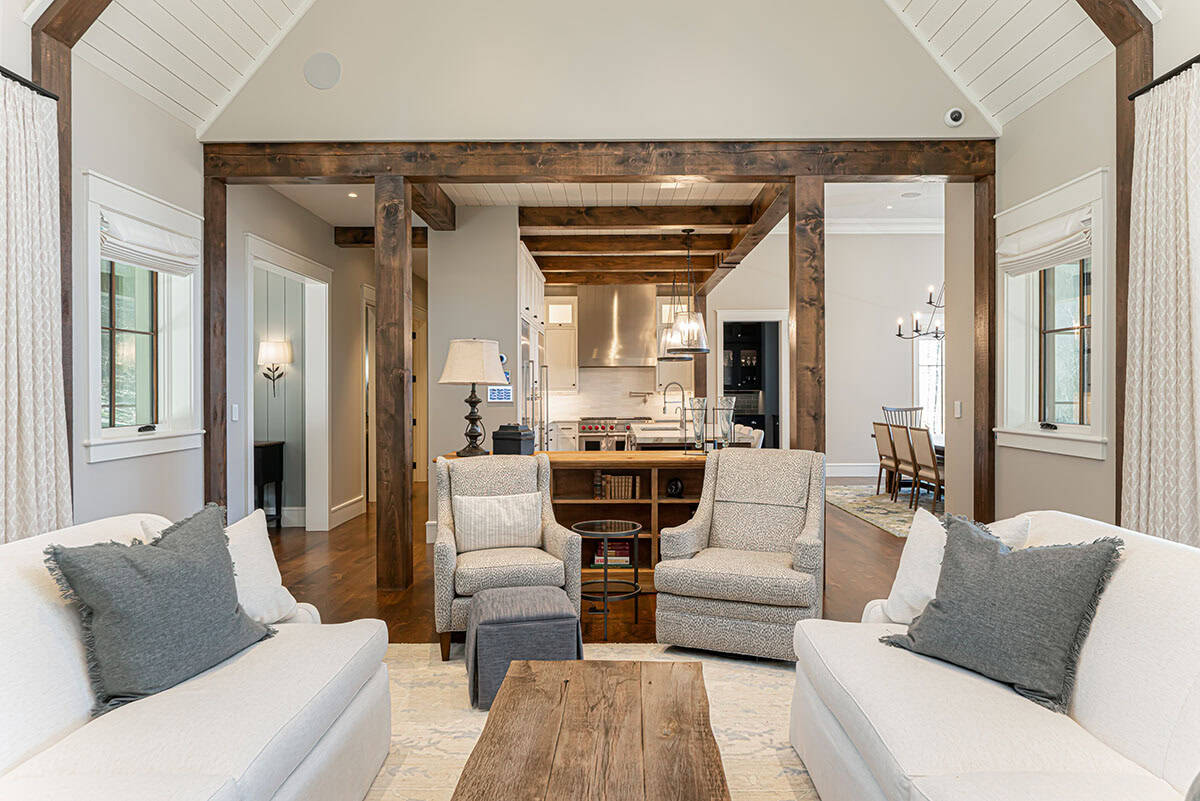 Living room open to kitchen with reclaimed wood coffee table