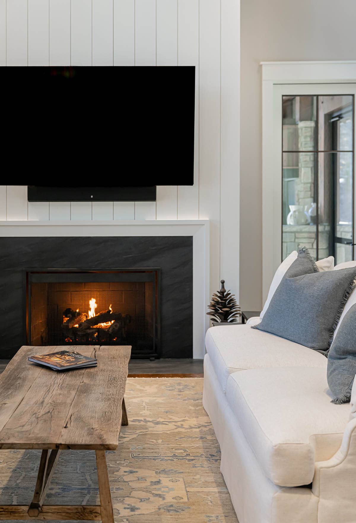 Gas fireplace detail with reclaimed wood coffee table