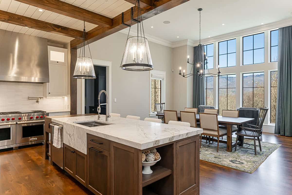 Kitchen island with marble countertop and dining area views