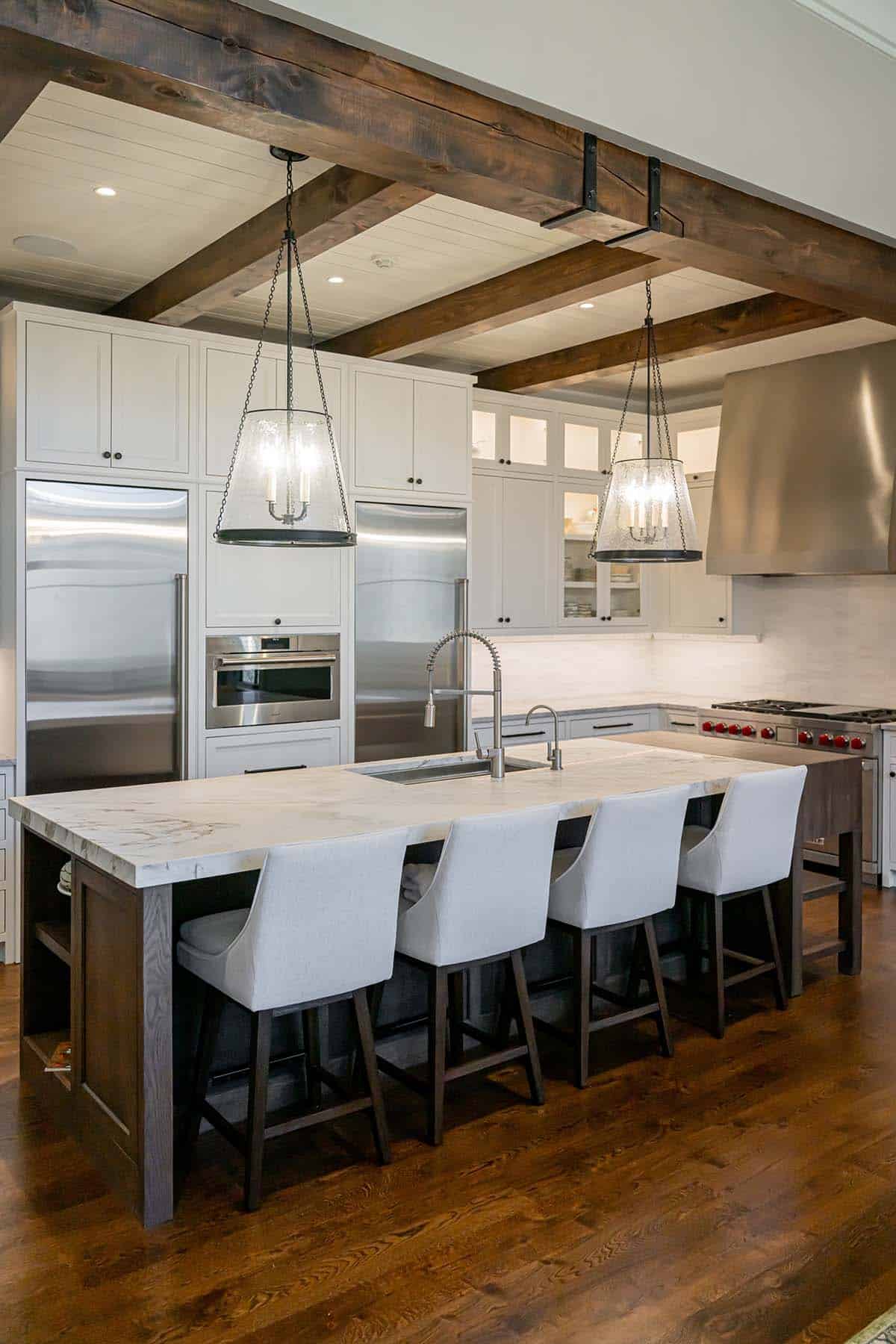 Kitchen island with seating and stainless steel appliances