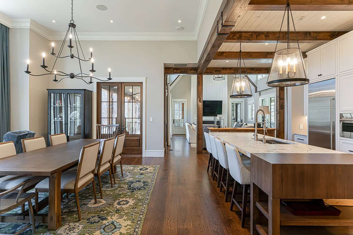 Open kitchen and dining area with timber beam accents