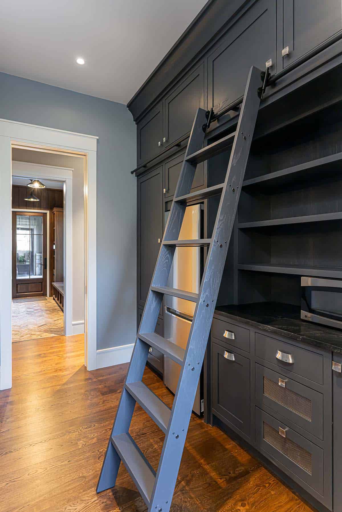 Pantry with sliding ladder and built-in shelving